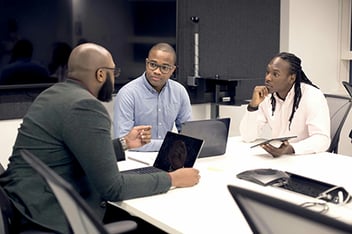 Job Seekers Speaking with a Volunteer Program Manager 