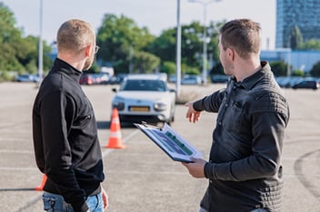 a volunteer manager explains the plan to a volunteer