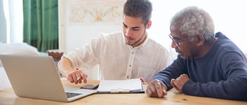Two volunteer managers planning a budget strategy