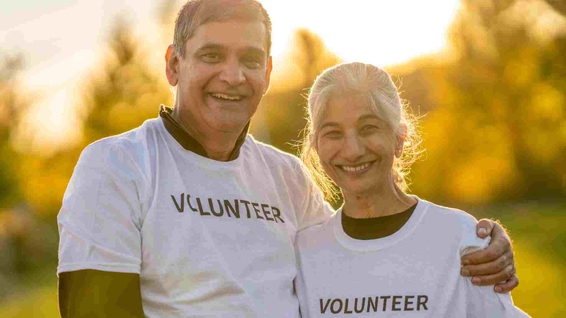 Senior volunteers smiling at a volunteer event 