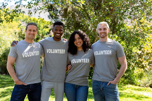 corporate volunteerism statistics concept; diverse group of smiling corporate volunteers