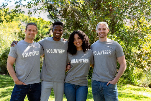 corporate volunteerism statistics concept; diverse group of smiling corporate volunteers